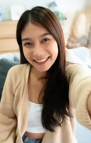Smiling woman taking a selfie